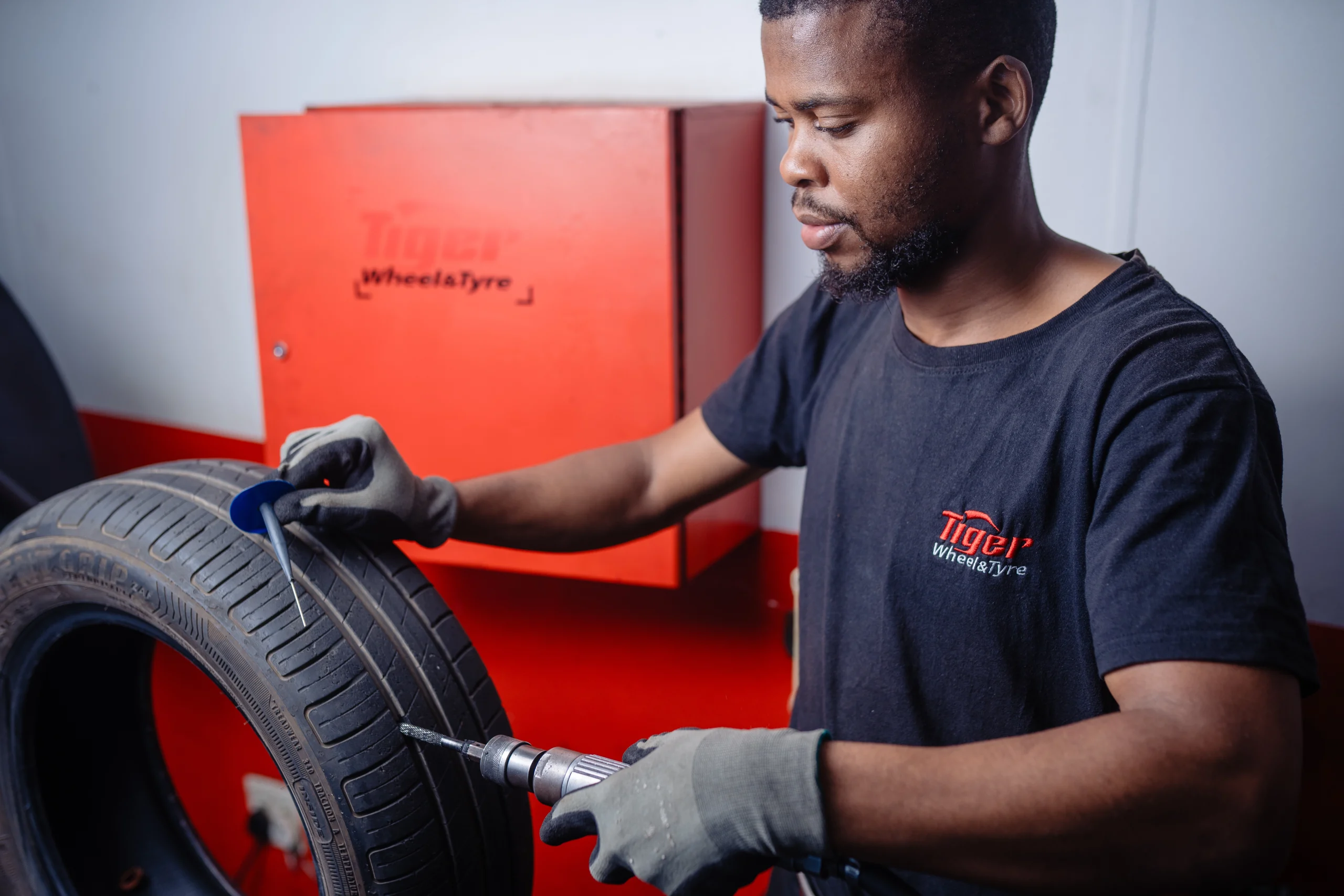 A Tiger Wheel & Tyre technician performing Tyre Puncture Repairs